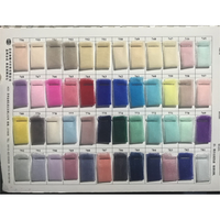 A color chart displaying 56 fabric swatches in rows of various shades, ranging from neutrals to vibrant blues and pinks, each labeled with a number.
