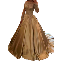 A luxurious gold ball gown with intricate lace embroidery and long sleeves. The elegant design conveys a sense of glamour and sophistication.
