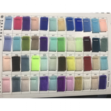 A neatly organized color swatch chart displays rows of small fabric samples in various hues, including blues, greens, pinks, purples, and neutrals.