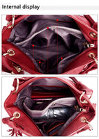 An internal view of a red handbag, showcasing multiple compartments and pockets for organization.