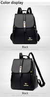 Black backpack with gold accents, featuring a stylish flap closure and adjustable straps, displayed on a light gray background.
