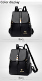 Black backpack with gold accents, featuring a stylish flap closure and adjustable straps, displayed on a light gray background.