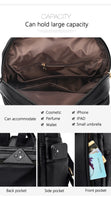 Black multifunctional bag with large compartments for cosmetics, electronics, and personal items; features various pockets for easy access.