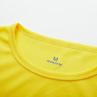 Close-up of a vibrant yellow polyester shirt collar, displaying size 'M' and fabric composition details.
