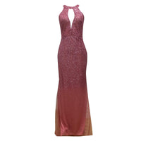 Elegant long pink dress with a fitted silhouette, glittering fabric, and a keyhole neckline. The gown exudes a glamorous and sophisticated tone.