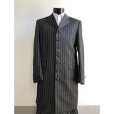 Mannequin wearing a black, pinstriped long coat with a white shirt. The coat has a high collar, buttoned front, and a formal, elegant appearance.