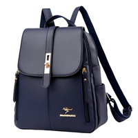 Navy blue leather backpack with a front flap, gold accents, and adjustable straps, featuring a kangaroo logo.