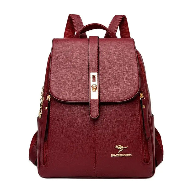 Stylish burgundy backpack with gold accents, front buckle closure, and adjustable straps, perfect for everyday use.