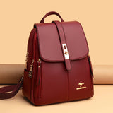Stylish burgundy leather backpack with gold hardware and a sleek design, featuring a top flap and side pockets.