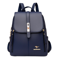 Stylish navy blue backpack with a gold clasp and zipper accents, featuring dual straps and a logo emblem on the lower front.