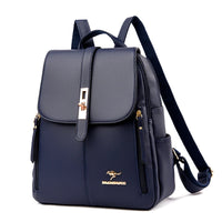 Stylish navy blue backpack with a sleek design, gold accents, and a front flap fastened by a decorative clasp.