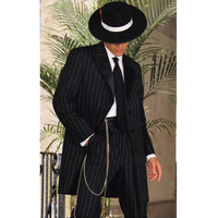 A person in a black pinstripe suit and tie, wearing a wide-brimmed hat. They stand near palm leaves, exuding a vintage, classy gangster vibe.