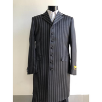 A mannequin displays a dark pinstripe suit with white vertical stripes and a white dress shirt underneath. The suit has a formal, elegant design.