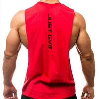 A muscular person wearing a red sleeveless shirt, featuring the text "JUST GYM." vertically printed on the back.