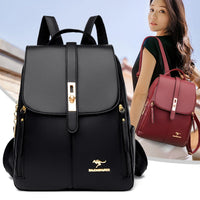 A stylish black backpack with gold accents displayed in front of a woman wearing a burgundy backpack.
