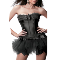 A woman wearing a black strapless corset with lace details and a tulle tutu skirt.