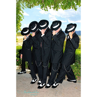 Five people dressed in black suits and white hats lean synchronously on a sunny day, set against a lush green backdrop under a leafy arch.