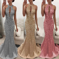 Three women wearing evening gowns. The dresses are glittering in silver, gold, and pink, with high necklines and mermaid cuts.