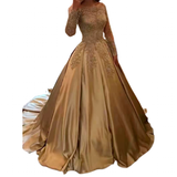 Elegant gold evening gown with intricate lace details on the bodice and sleeves, featuring a flowing satin skirt, exuding luxury and sophistication.