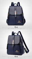 A stylish navy blue backpack with a sleek design, featuring a gold logo and zipper details, perfect for daily use.