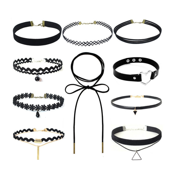 A collection of ten black chokers with varying designs, including lace, pearls, bows, and geometric pendants, arranged on a white background.