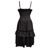 Elegant black dress with thin straps and a ruffled neckline. The fitted bodice flows into a two-tiered layered skirt, conveying a classic, sophisticated tone.