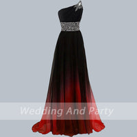 Elegant one-shoulder gown with a black bodice and red ombre skirt. Decorated with a jeweled star detail and waistband. 