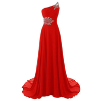 Elegant red evening gown with a one-shoulder design, featuring silver embellishments on the shoulder and waist. The fabric flows gracefully to the floor.