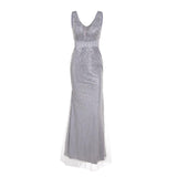 Elegant silver evening gown with a V-neck and sleeveless design. The dress features a fitted waist and shimmering embellishments, exuding sophistication.