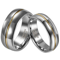 Two tungsten carbide rings with a sleek silver finish and a central gold stripe, symbolizing unity and elegance. Rings display "Tungsten Carbide" text inside.