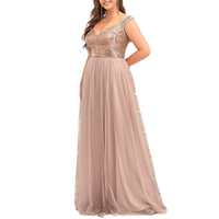 Woman in an elegant, floor-length pink gown with a sequined bodice and cap sleeves, exuding a formal and graceful tone.