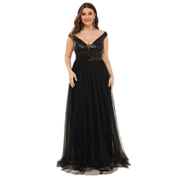 A woman wears an elegant black evening gown with sequined bodice and flowing skirt, exuding glamour and sophistication. She smiles warmly.