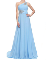 A floor-length, light blue gown with a one-shoulder design, embellished with silver floral details at the waist and shoulder, conveying elegance and grace.
