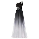 Elegant one-shoulder gown with a black-to-white ombre effect. Features intricate beading on the shoulder and bodice, creating a sophisticated look.