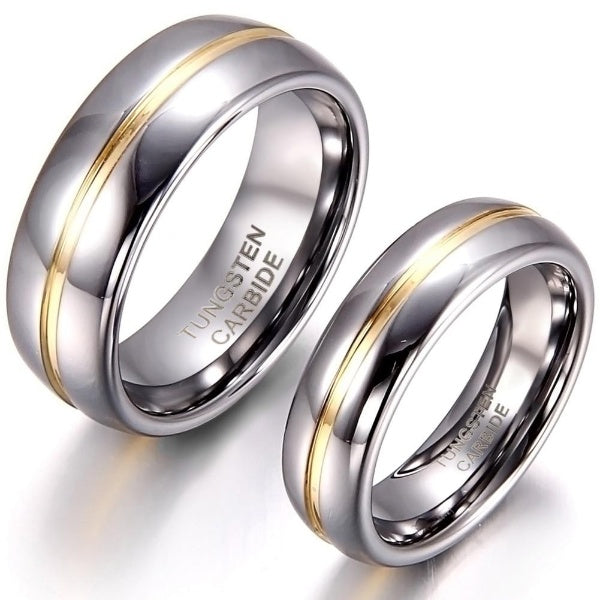 Two polished tungsten carbide rings with a smooth silver finish and a central gold stripe. The rings are placed elegantly side by side, suggesting a sophisticated and modern design.